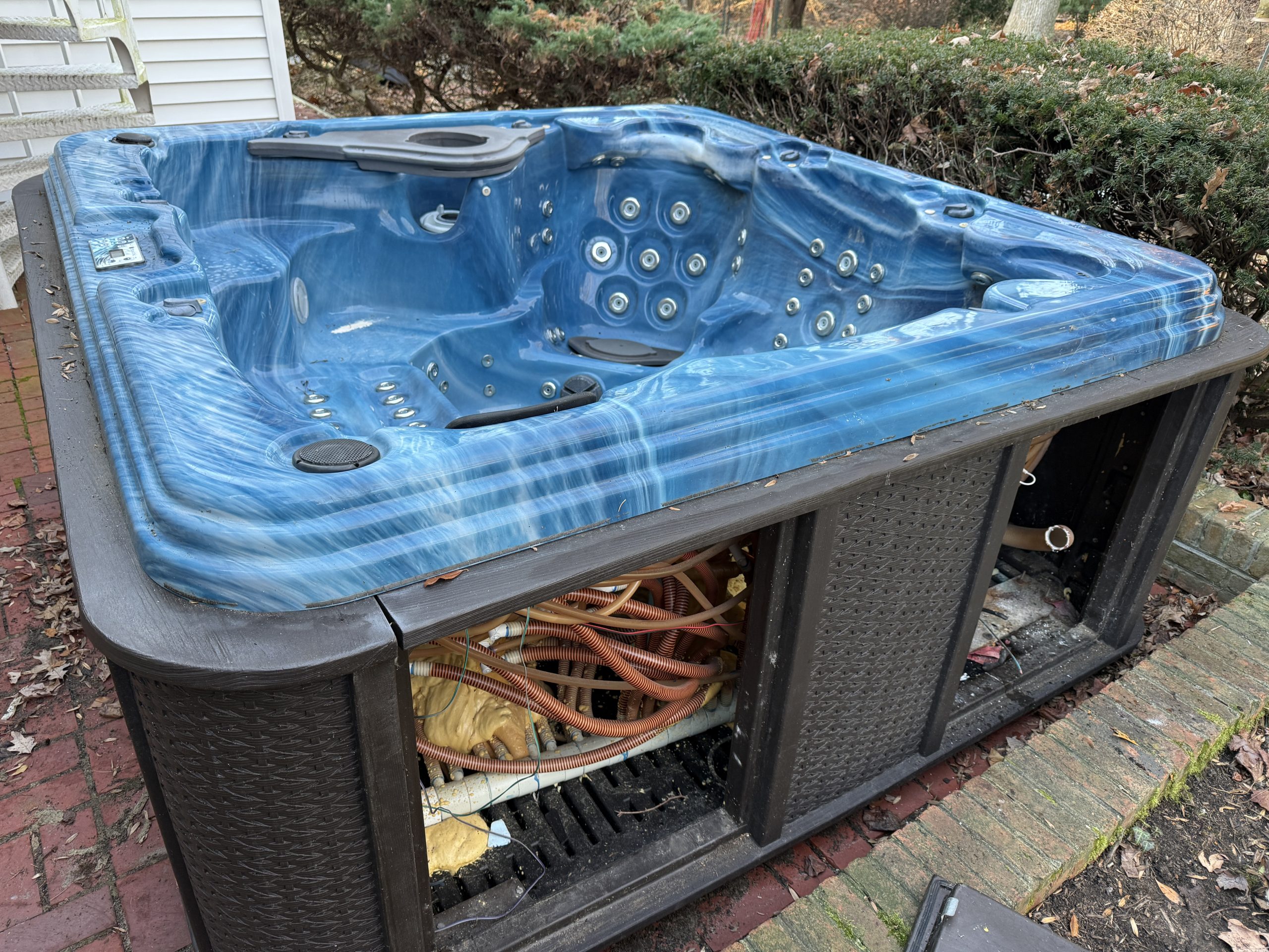 Blue hot tub ready for removal