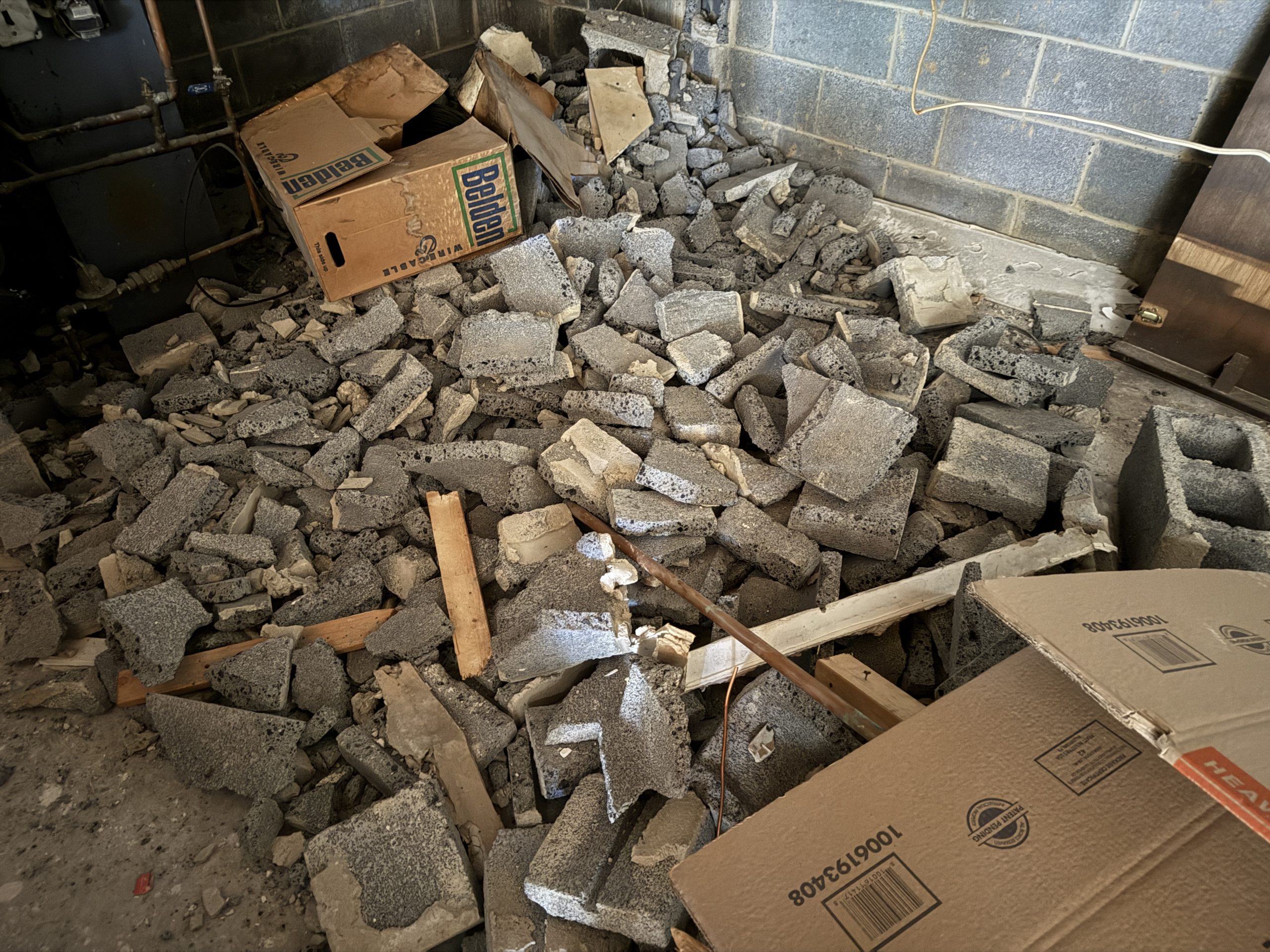 Broken cinder blocks in basement