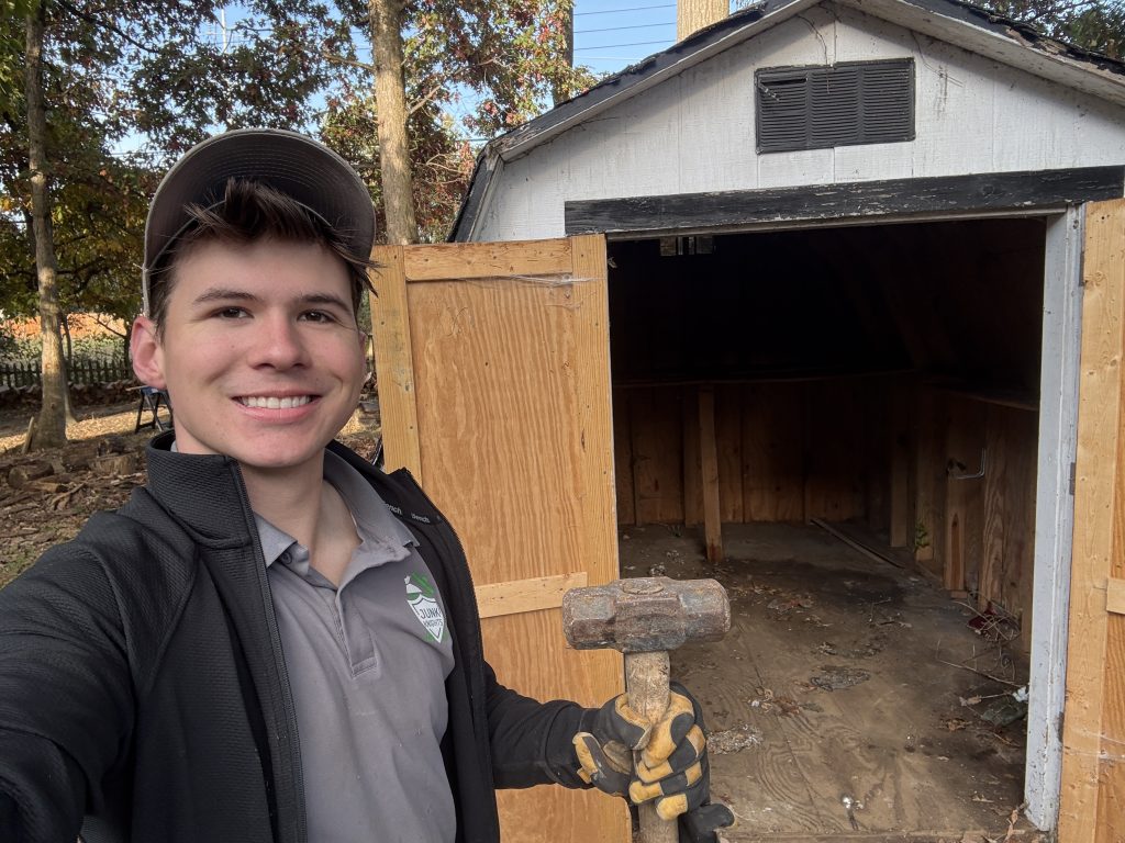 Emory from Junk Knights tearing down a customer's shed