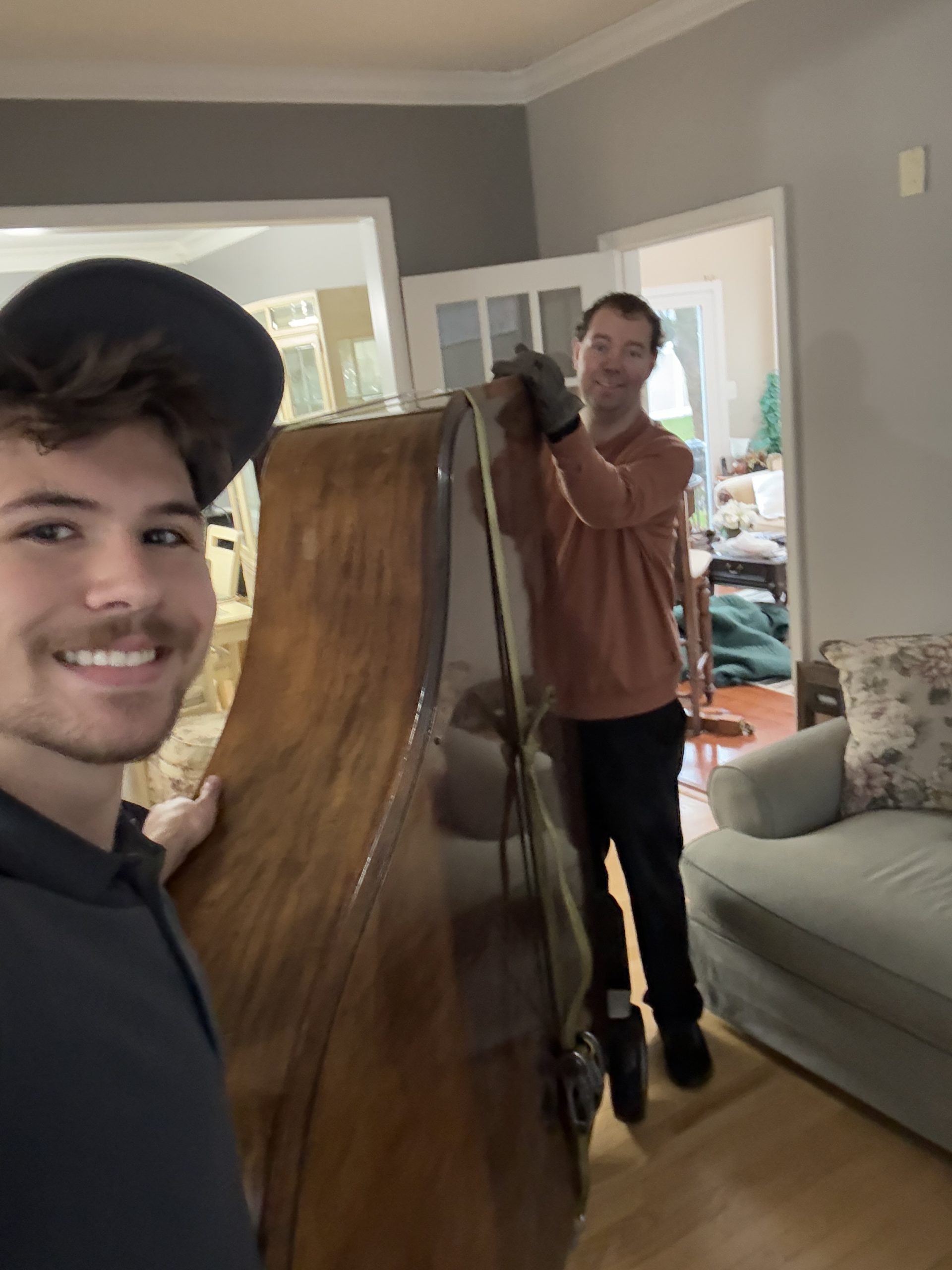 Junk Knights crew moving a baby grand piano
